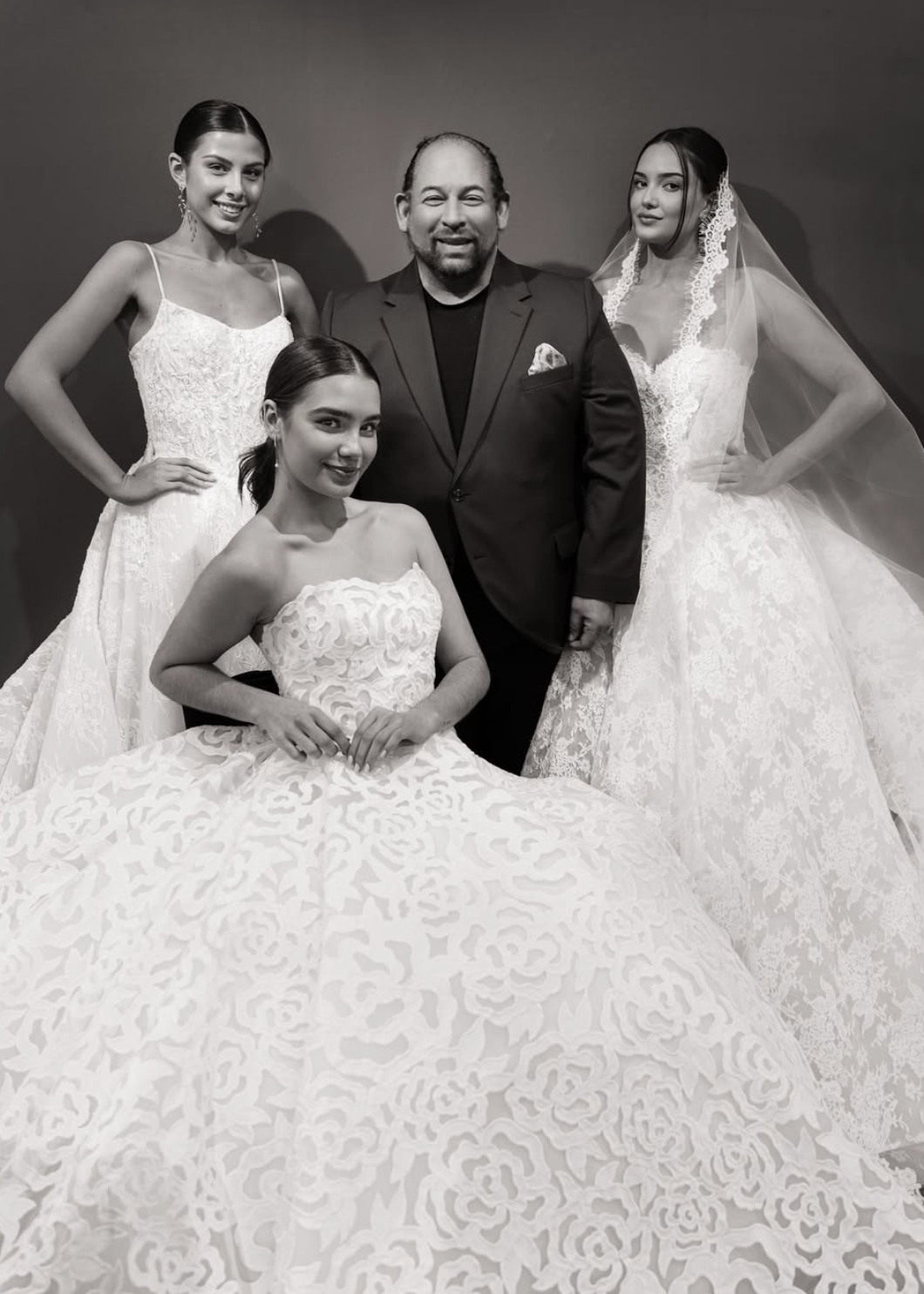 Lazaro surrounded by his muses and his latest collection S/S 2027, available during the Lazaro trunk show at Bridals by Lori in Atlanta Oct 30-Nov 8