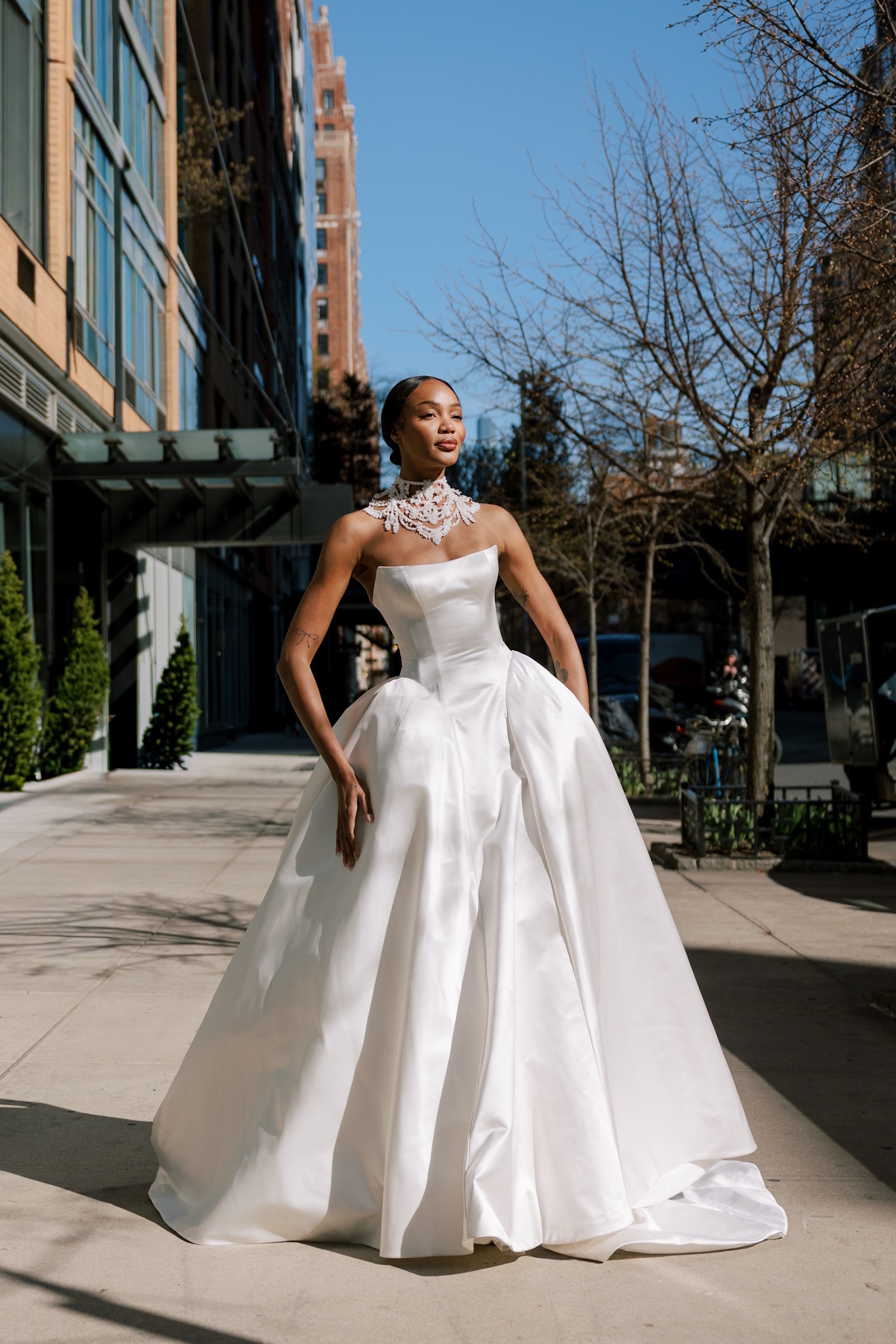 wedding gown from Pnina Tornia's S/S 2027 collection prancing through New York streets, available at Bridals by Lori Nov 20 -30 in Atlanta