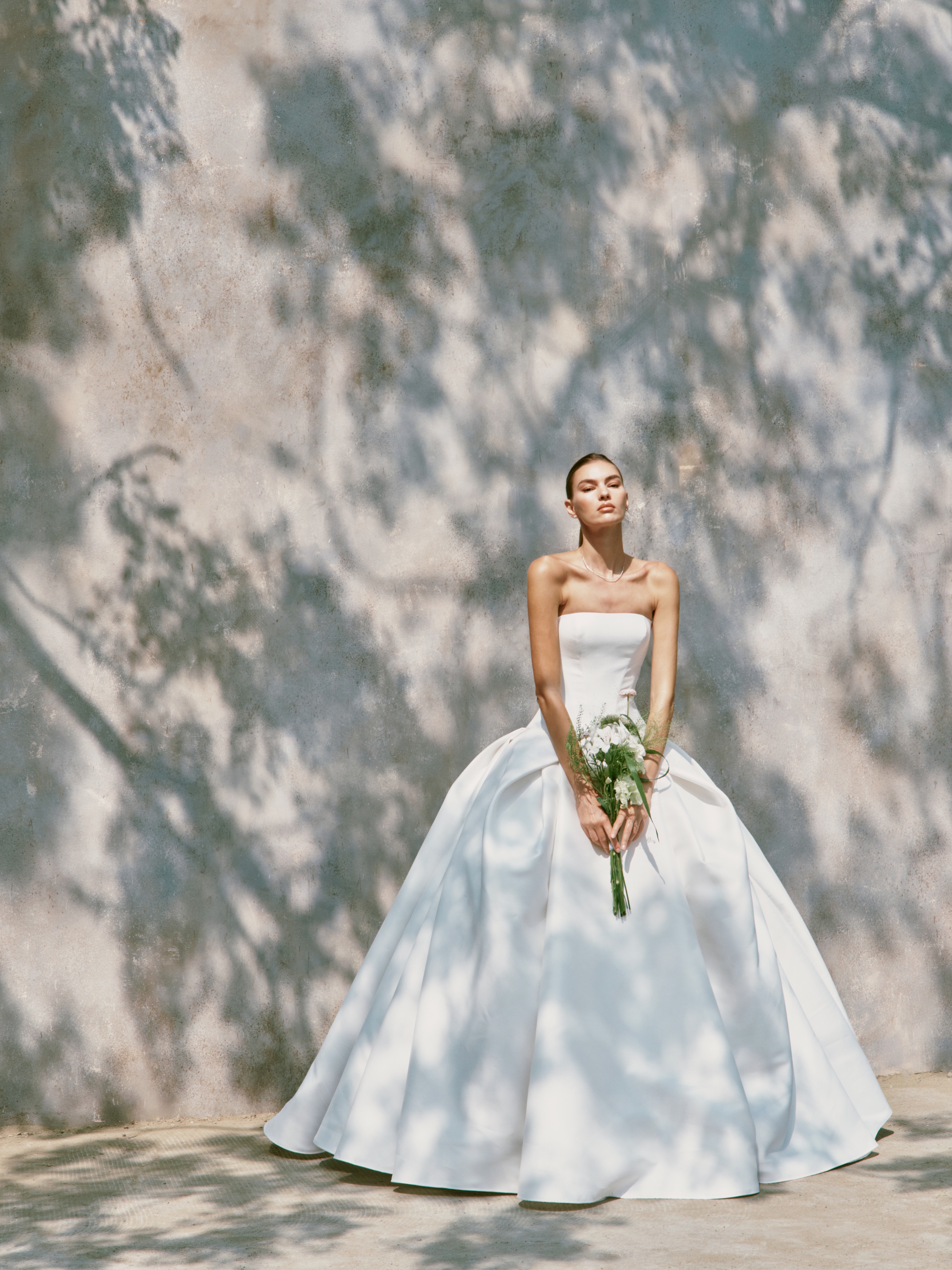  campaign image from the latest Nicole + Felicia S/S 2027 collection, available at Bridals by Lori in Atlanta from August 28-September 6